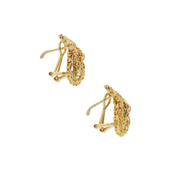 Aretes boleados en oro amarillo 18 kilates.