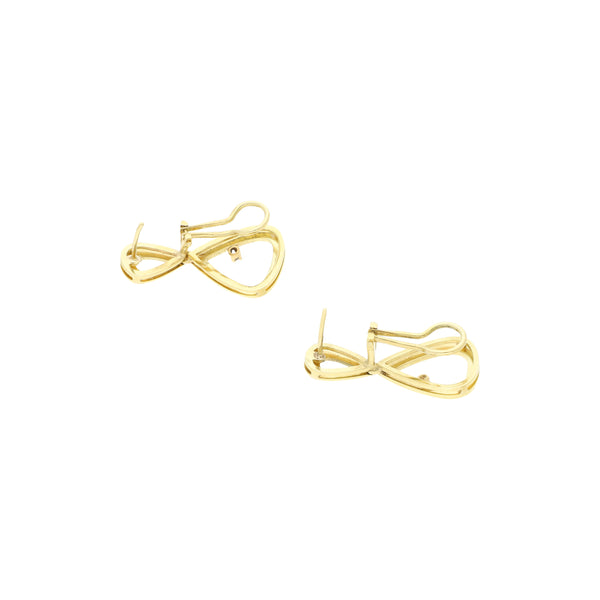 Aretes estilizados con diamantes en oro amarillo 14 kilates.