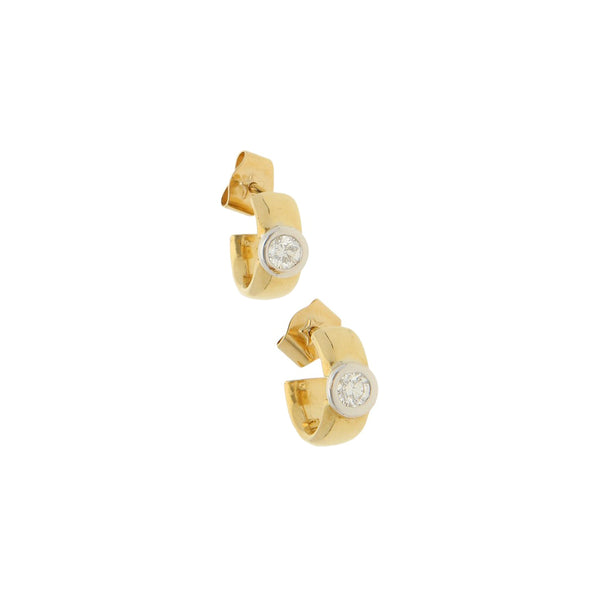 Broqueles lisos con diamante en oro dos tonos 18 kilates.
