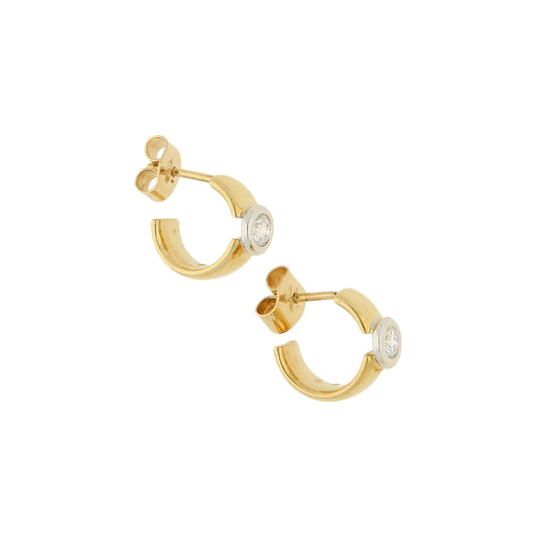 Broqueles lisos con diamante en oro dos tonos 18 kilates.