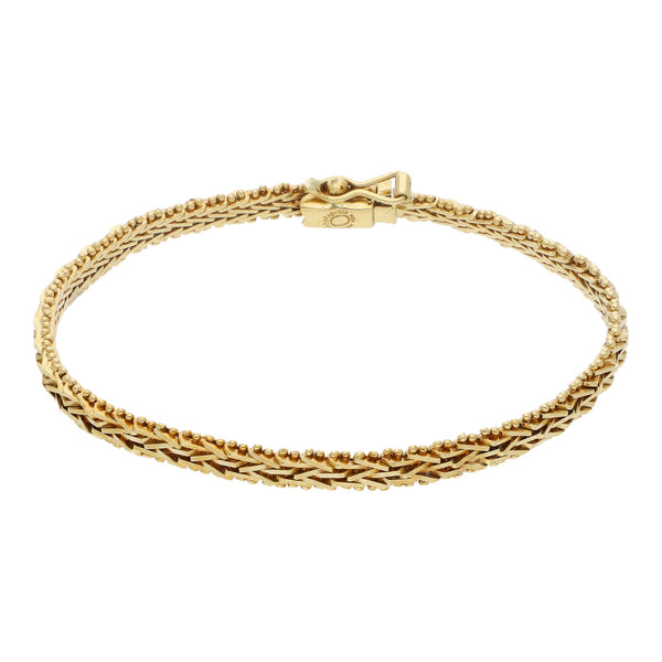 Pulsera eslabón boleado en oro amarillo 18 kilates.