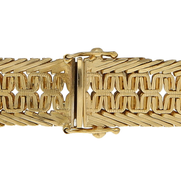 Pulsera eslabón tejido en oro amarillo18 kilates.