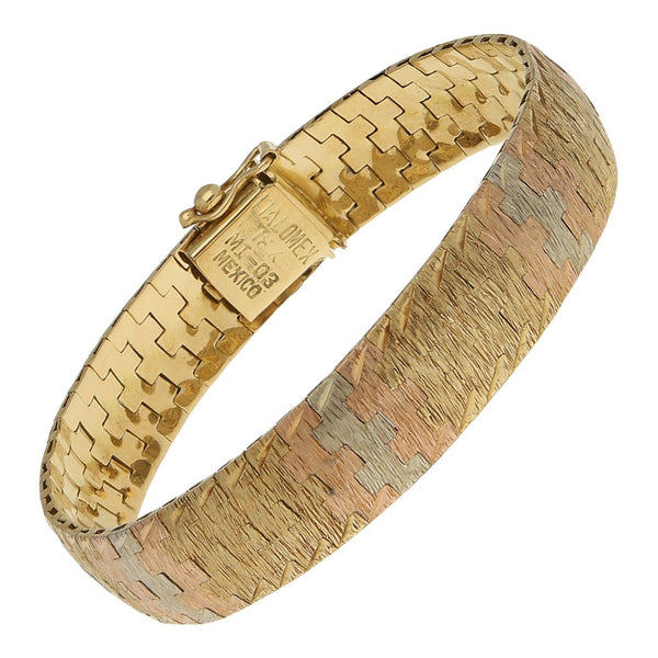 Pulsera eslabón articulado en oro tres tonos 18 kilates.