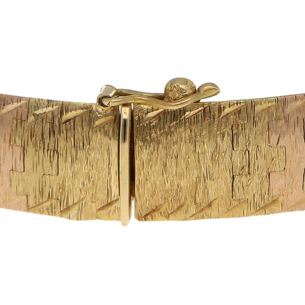 Pulsera eslabón articulado en oro tres tonos 18 kilates.