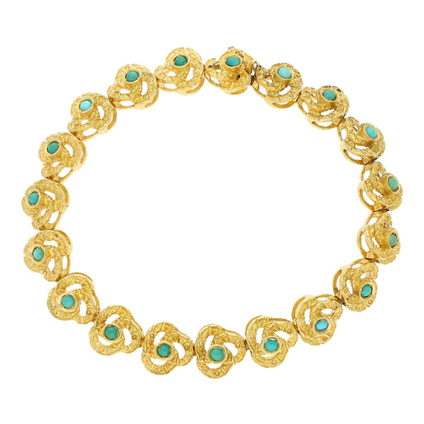 Pulsera eslabón articualdo con sintéticos en oro amarillo 18 kilates.