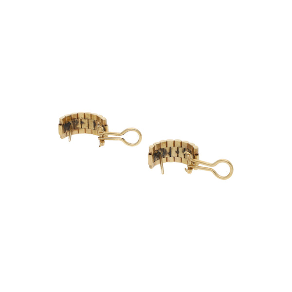 Aretes diseño especial en oro amarillo 14 kilates.
