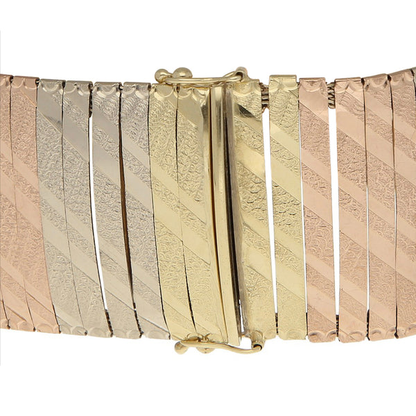 Pulsera eslabón laminado en oro tres tonos 14 kilates.