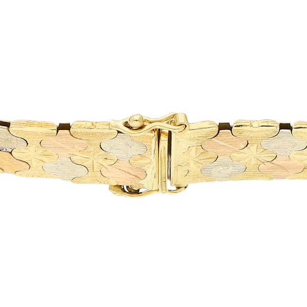 Pulsera eslabón articulado en oro tres tonos 18 kilates.