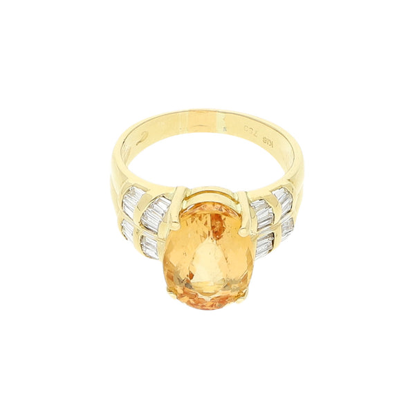 Anillo diseño especial con diamantes y sintético en oro amarillo 14 kilates.