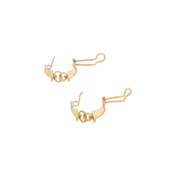 Aretes calados con diamantes en oro amarillo 14 kilates.