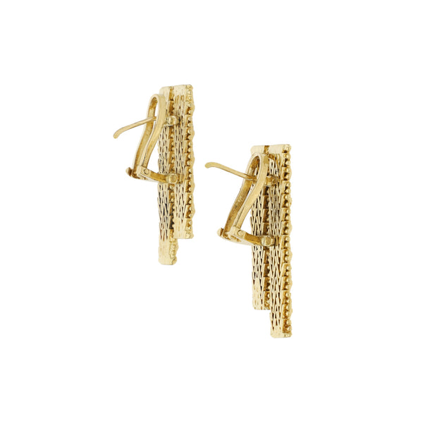 Aretes boleados en oro amarillo 18 kilates.