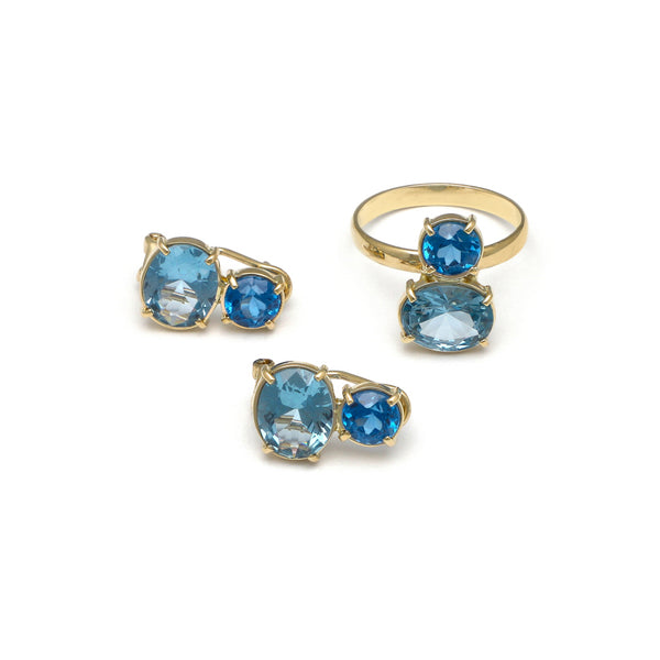 Juego de anillo y aretes diseño especial con agua marina y topacio azul en oro amarillo 14 kilates.
