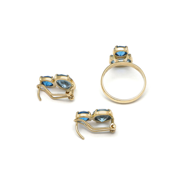 Juego de anillo y aretes diseño especial con agua marina y topacio azul en oro amarillo 14 kilates.