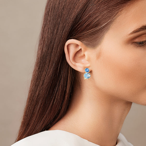 Juego de anillo y aretes diseño especial con agua marina y topacio azul en oro amarillo 14 kilates.
