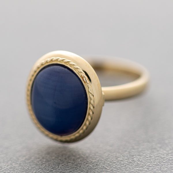 Juego de anillo y aretes diseño especial con zafiro estrella en oro amarillo 14 kilates.