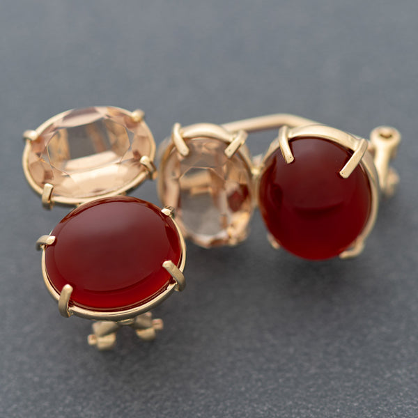 Aretes diseño especial con topacio y cornolita en oro amarillo 14 kilates.