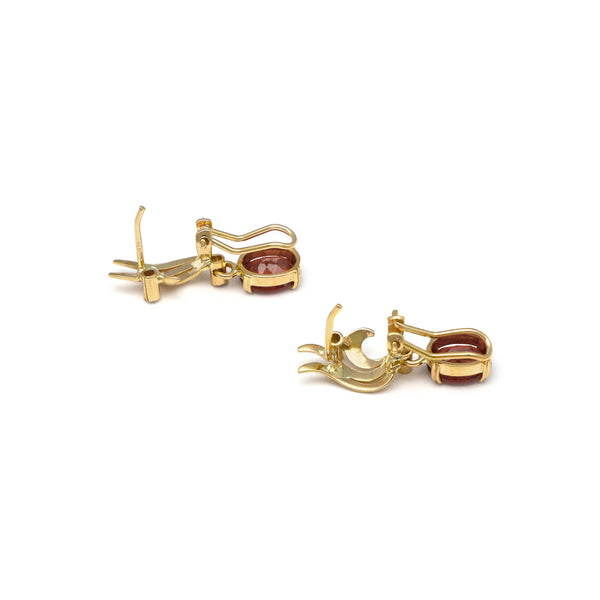 Aretes diseño especial con colgantes diamantes y titanita en oro amarillos 14 kilates.