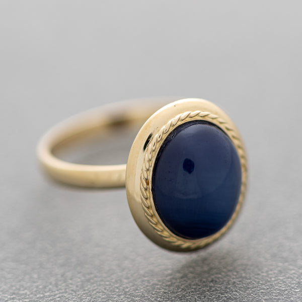Juego de anillo y aretes diseño especial con zafiro estrella en oro amarillo 14 kilates.