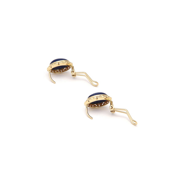 Juego de anillo y aretes calados con zafiro estrella en oro amarillo 14 kilates.