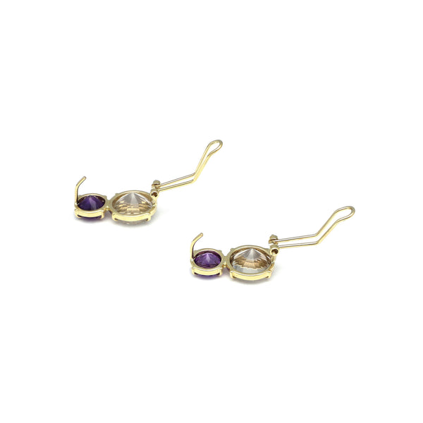 Juego de anillo y aretes diseño especial con amatista y topacio en oro amarillo 14 kilates.