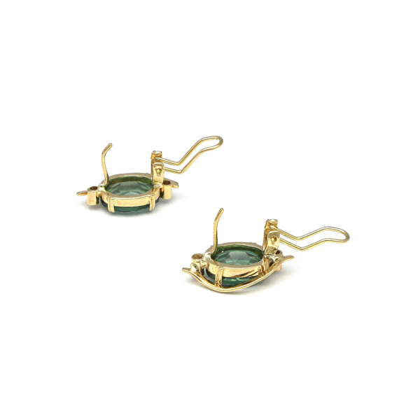 Juego de anillo y aretes calados con cuarzos y circonias en oro amarillo 14 kilates.
