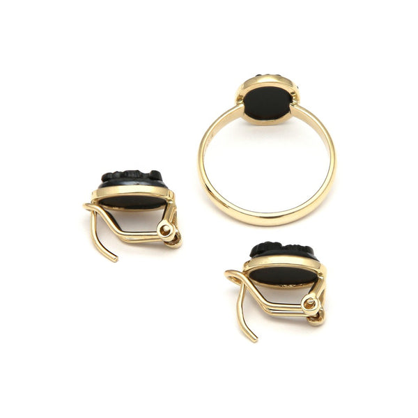 Juego de anillo y aretes diseño especial Motivo dama de perfil con ónix en oro amarillo 14 kilates.