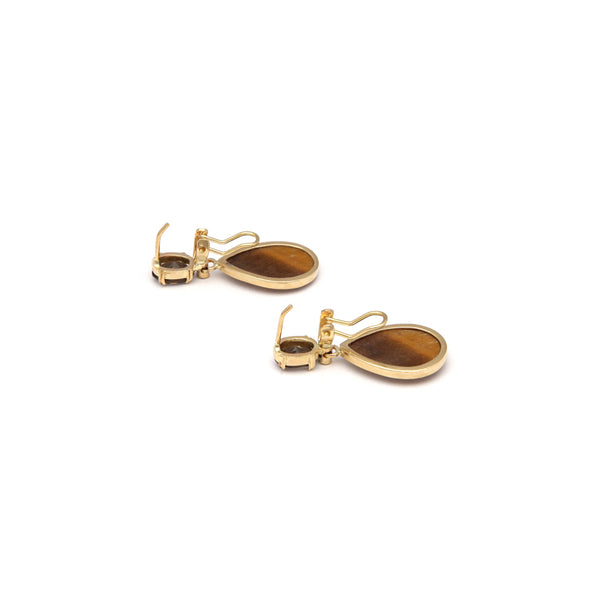 Juego de anillo y aretes estilizados con colgantes de topacios, ojos de tigre y sintéticos en oro amarillo 14 kilates.