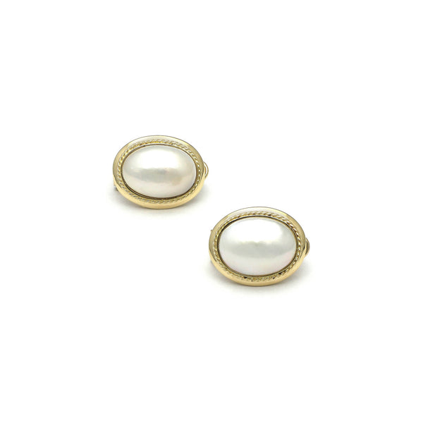 Aretes diseño especial con medias perlas en oro amarillo 14 kilates.