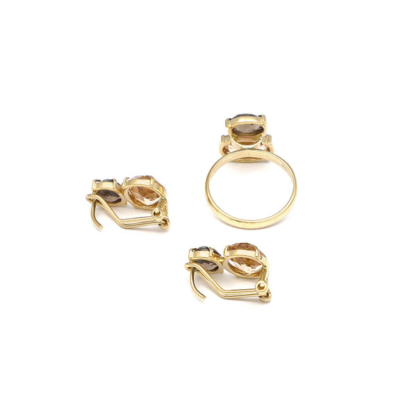 Juego de anillo y aretes diseño especial con topacio ahumado en oro amarillo 14 kilates.