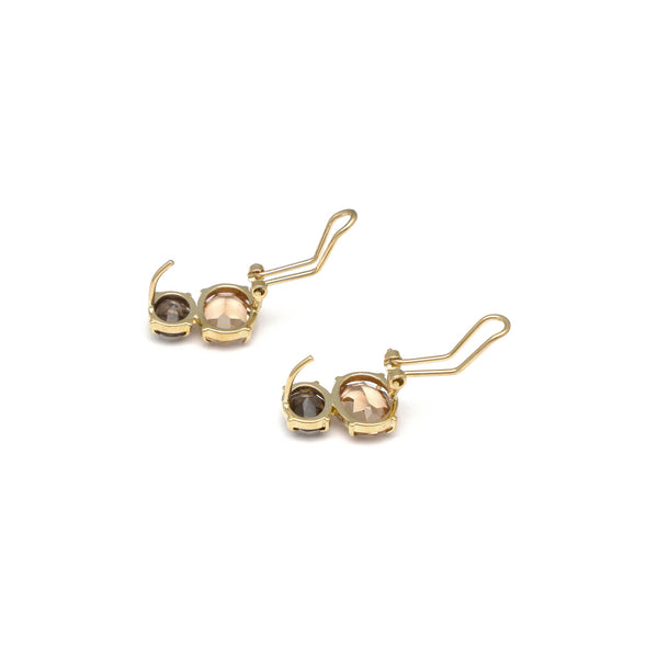 Juego de anillo y aretes diseño especial con topacio ahumado en oro amarillo 14 kilates.