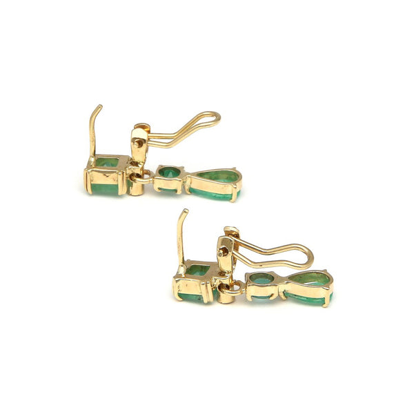 Juego de anillo y aretes diseño especial con diamantes y esmeraldas en oro amarillo 14 kilates.