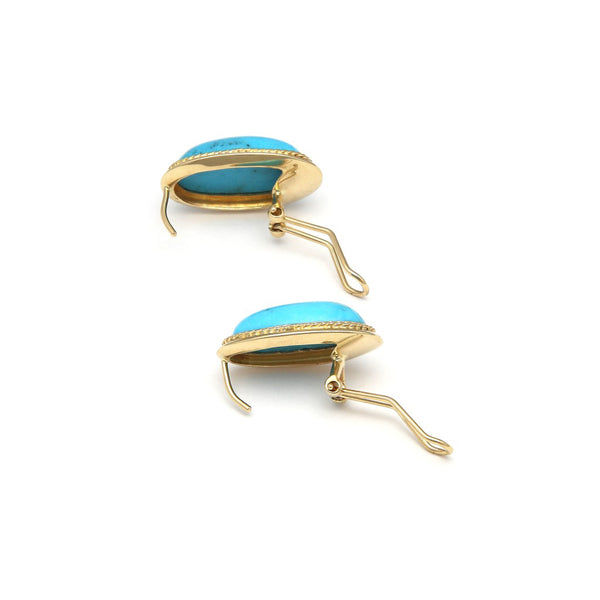 Juego de anillo y aretes diseño especial con turquesas en oro amarillo 14 kilates.