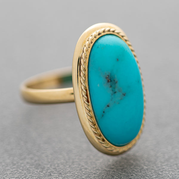 Juego de anillo y aretes diseño especial con turquesas en oro amarillo 14 kilates.