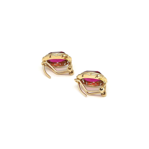 Aretes diseño especial con rubíes en oro amarillo 14 kilates.