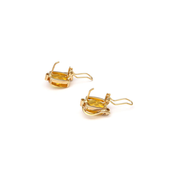 Juego de anillo y aretes calados con citrinos y sintéticos en oro amarillo 14 kilates.