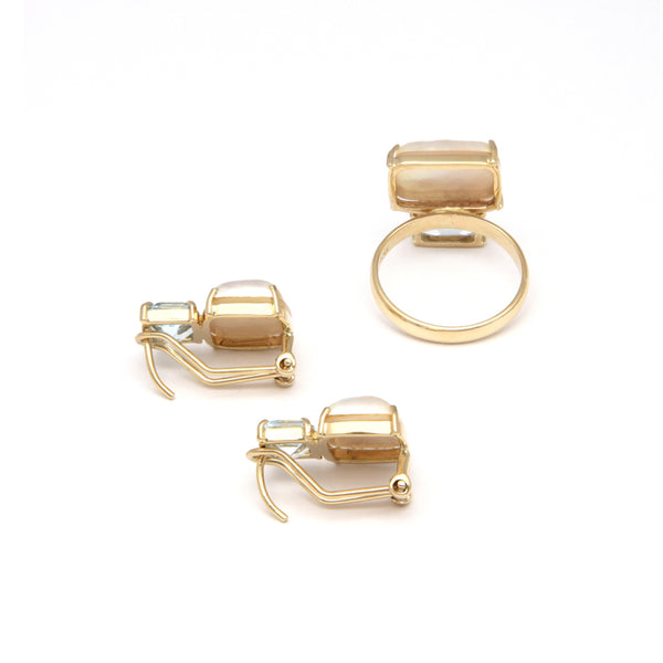 Juego de anillo y aretes diseño especial con Media perla y topacios en oro amarillo 14 kilates.