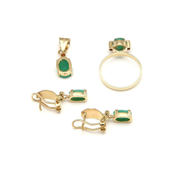 Juego de anillo, aretes y dije diseño especial con diamantes y esmeraldas en oro amarillo 14 kilates.