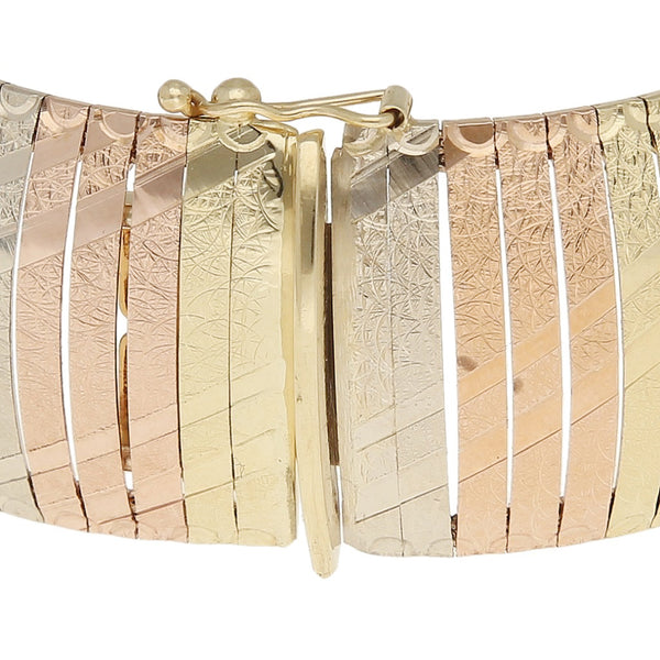 Pulsera eslabón laminado en oro tres tonos 14 kilates.