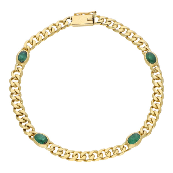 Pulsera eslabón encontrado con aplicaciones y esmeraldas en oro amarillo 18 kilates.