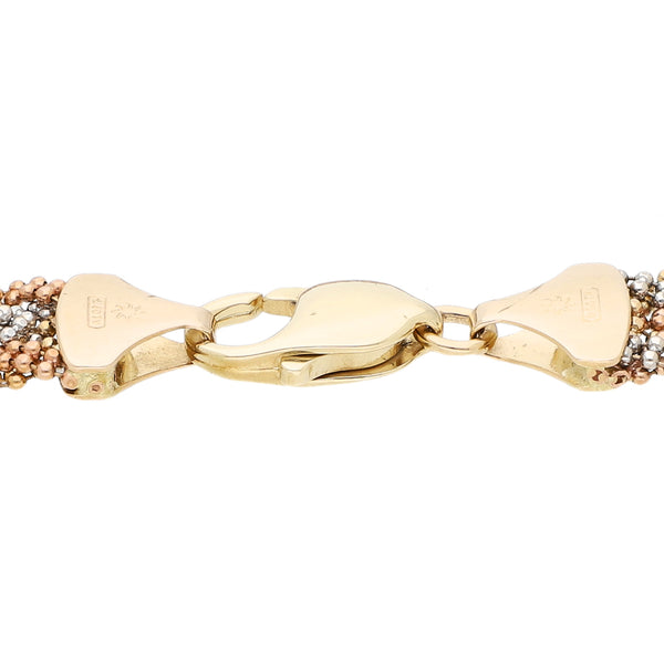 Pulsera eslabón tejido en oro tres tonos 14 kilates.
