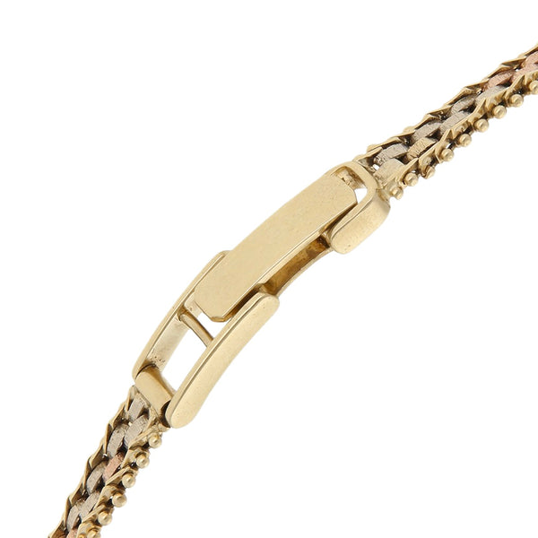 Reloj Geneve para dama en oro tres tonos 14 kilates.