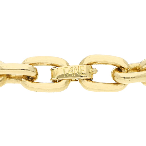 Pulsera eslabón cruzado firma Tane en oro amarillo 18 kilates.