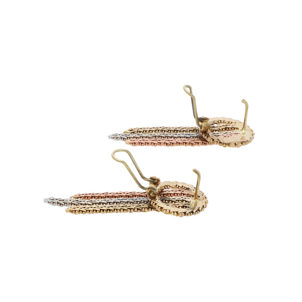 Aretes boleados en oro tres tonos 14 kilates.