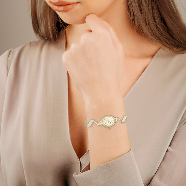 Reloj Geneve para dama en oro dos tonos 14 kilates.