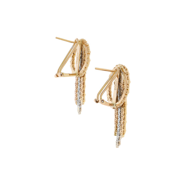 Aretes boleados en oro dos tonos 18 kilates.