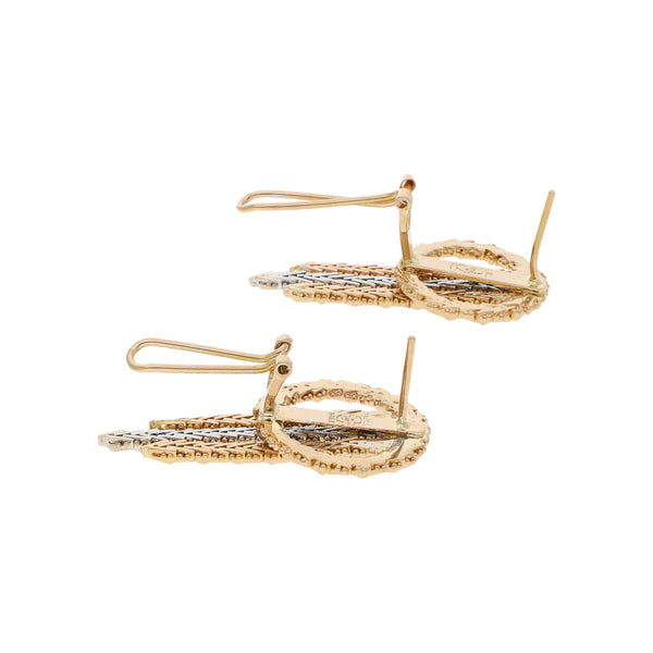 Aretes boleados en oro dos tonos 18 kilates.