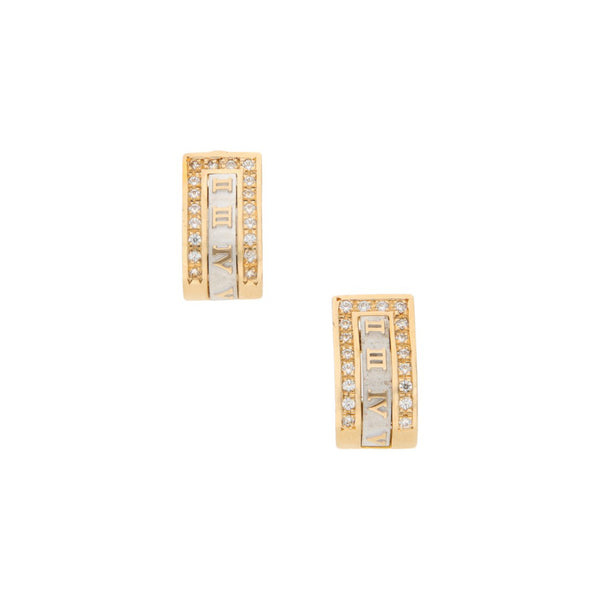 Aretes diseño especial motivo números romanos con circonias en oro dos tonos 14 kilates.