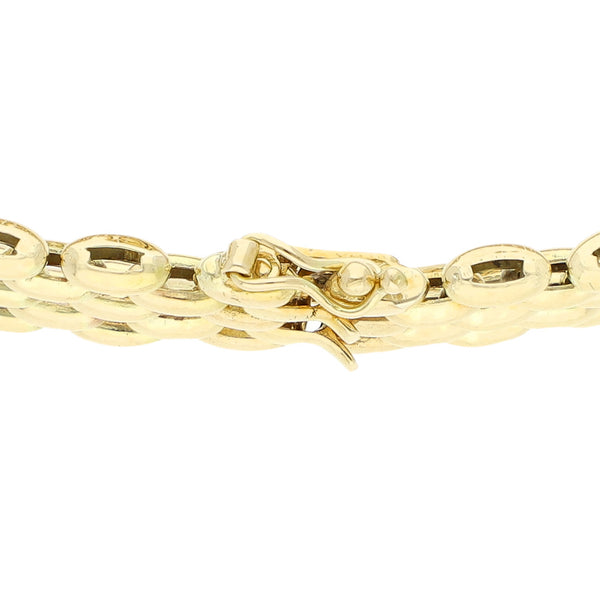Pulsera eslabón articulado con sintéticos en oro amarillo 14 kilates.