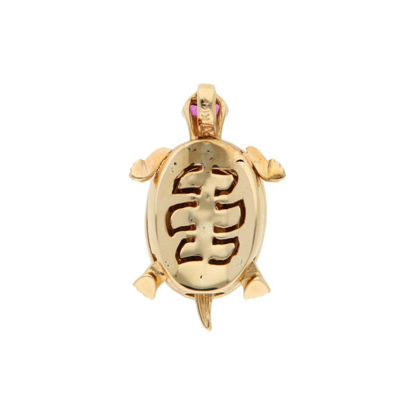 Dije diseño especial motivo tortuga con sintéticos en oro tres tonos 14 kilates.