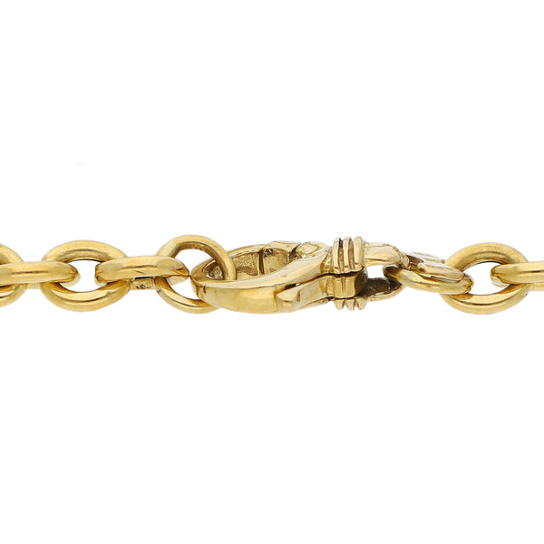 Pulsera eslabón cruzado con aplicaciones en oro amarillo 18 kilates.